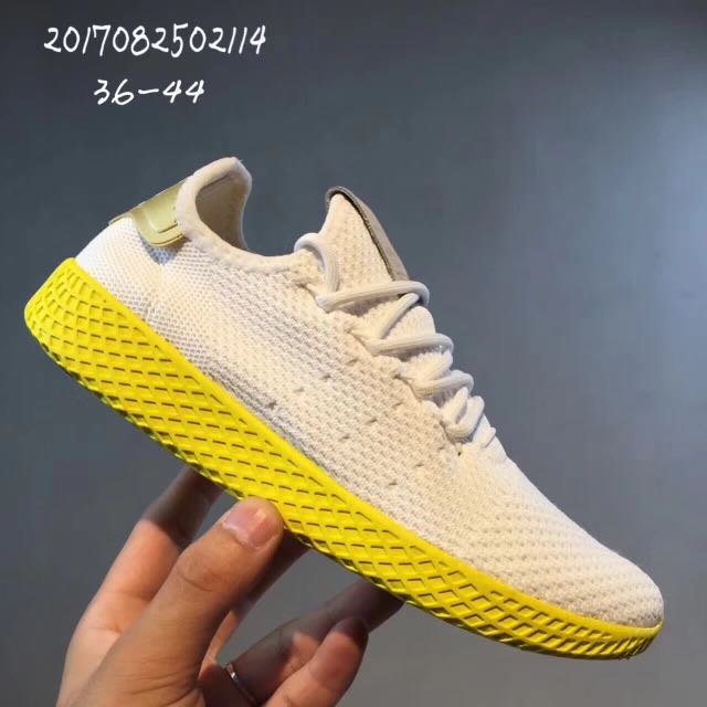 human race yellow sneakers