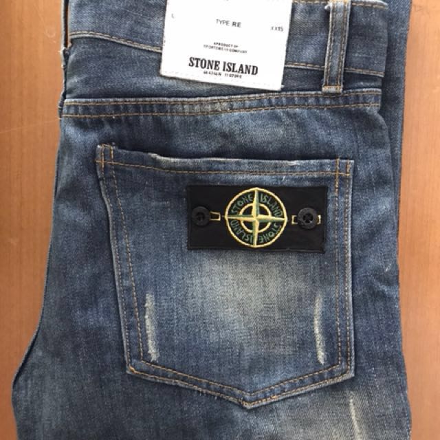 stone island ripped jeans