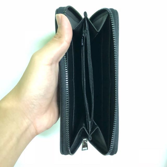 WALLET (LONG) (Category: Wallets & Card Holders) located in Singapore. Submitted by anselho (Listing ID 146789618, Image 3). Description: Long wallet Black with minimalistic design Zip compartment in the center for coins 8 cardholding slots Unisex!.