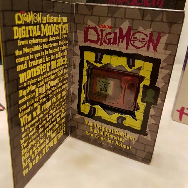 digimon version 1 (Category: Interactive Toys) located in Singapore. Submitted by ben_xio (Listing ID 146831713, Image 3). Description: tip top new sparkling ver 1997 english USa/europe version twin pair transparent swee! near extinction~ 2 for 400.