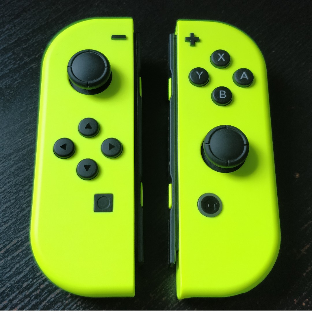 nintendo switch with yellow joy cons