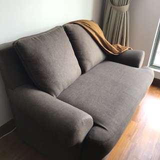 Two seater fabric sofa with removable cushions
