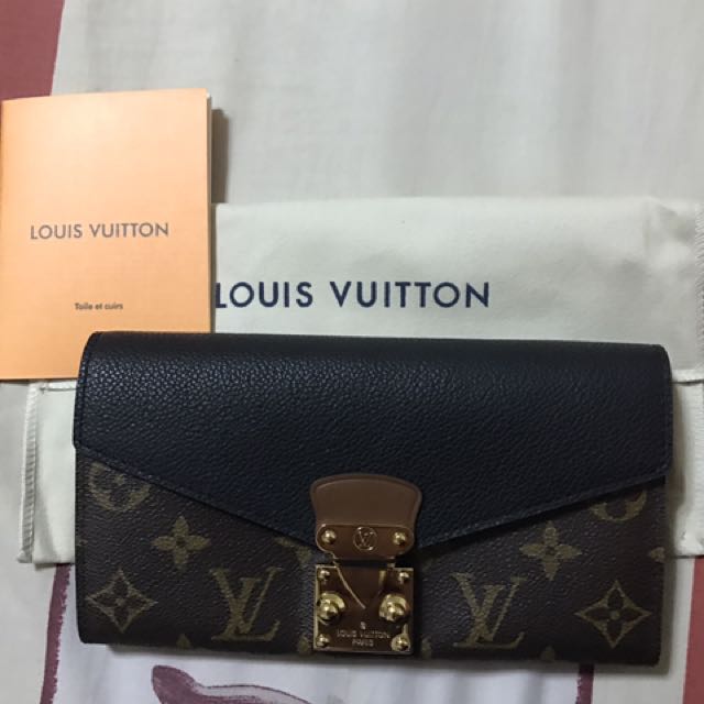 Louis Vuitton Monogram Pallas (Category: Wallets & Card holders) located in Quezon City. Submitted by achitoni (Listing ID 147769021, Image 1). Description: LV Monogram Pallas wallet. Looks new. Not sure of authenticity. Bought from an online store selling Japan bought bags..