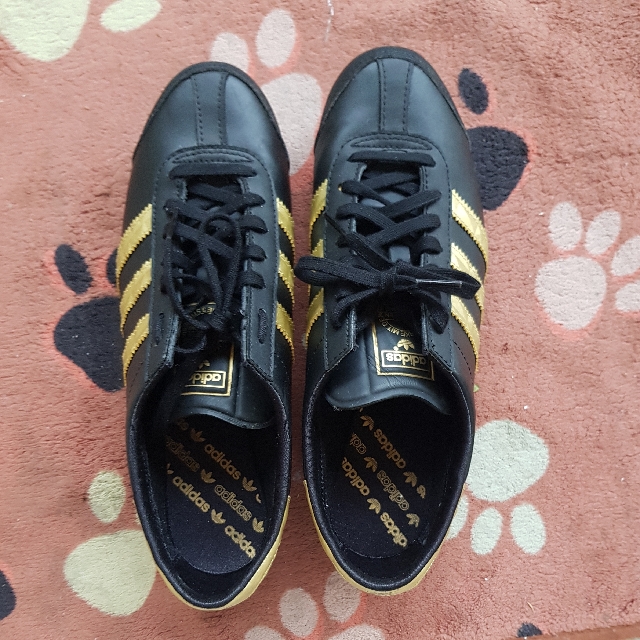 black adidas shoes with gold