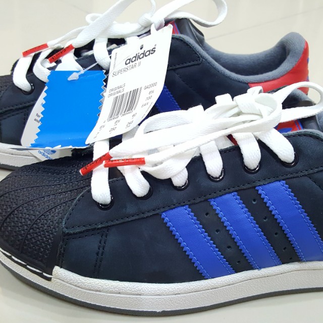 Superstar black store with blue stripes