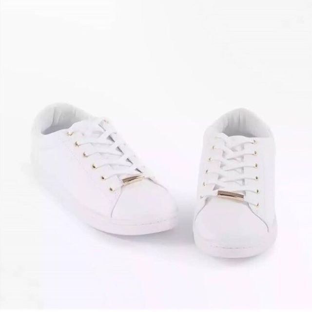 white metallic trainers