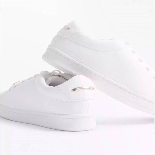 white metallic trainers