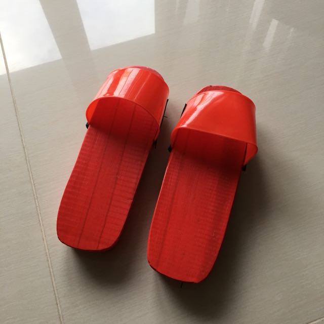 red wooden clogs