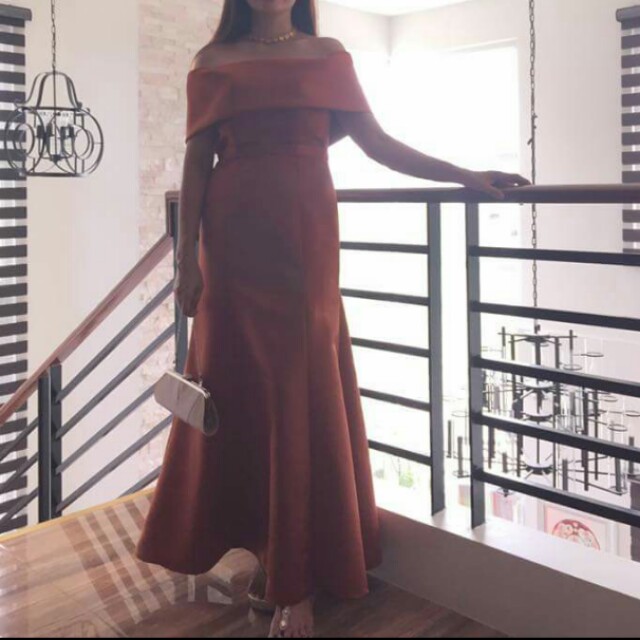 Off Shoulder Copper Rust Long Gown for RENT (Category: Evening dresses & gowns) located in Cavite. Submitted by melonpansss (Listing ID 150192591, Image 2). Description: Color: Tangerine / Orange Size: MEDIUM Model size: 36- Bust / 27 - Waist / 5'6- Height.