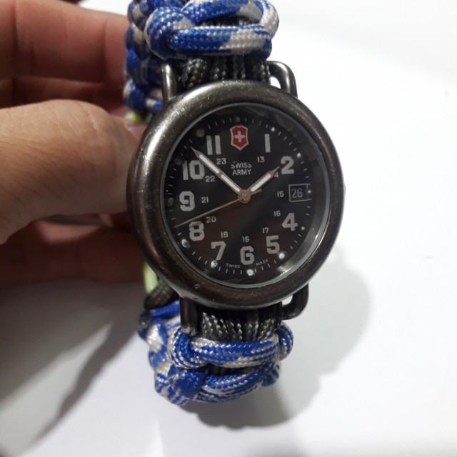 SWISS ARMY WATCH (Category: Men's Watches) located in Manila. Submitted by thegreat. (Listing ID 150208726, Image 2). Description: Authentic Original Vintage classic look sign of usage stain on dial but not so noticeable Good running condition Swiss made Paracord strap Wrist size. 18 cm.