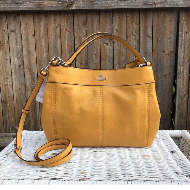 mustard coach purse