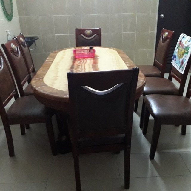 Dining table (Category: Chairs) located in Sungai Petani. Submitted by happystorm_3a797e (Listing ID 151195342, Image 2). Description: Dining table stil new...top of the table is marble and down is craft...very heavy with 8 chairs..price is negotatiable..