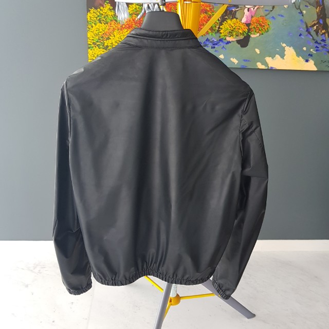 Authentic Prada Jacket (Category: Hoodies) located in Singapore. Submitted by meister.schmeister (Listing ID 151661389, Image 2). Description: Authentic Prada black jacket. Size: 48. Mint condition. Only worn 4/5 times. Fixed price..