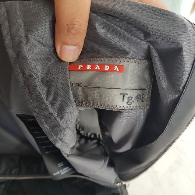 Authentic Prada Jacket (Category: Hoodies) located in Singapore. Submitted by meister.schmeister (Listing ID 151661389, Image 3). Description: Authentic Prada black jacket. Size: 48. Mint condition. Only worn 4/5 times. Fixed price..