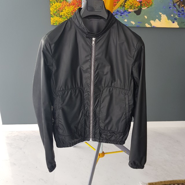 Authentic Prada Jacket (Category: Hoodies) located in Singapore. Submitted by meister.schmeister (Listing ID 151661389, Image 1). Description: Authentic Prada black jacket. Size: 48. Mint condition. Only worn 4/5 times. Fixed price..