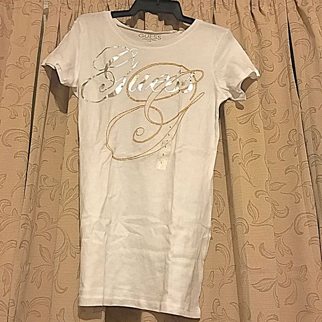 white and gold guess shirt