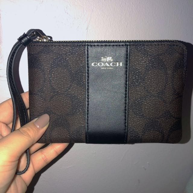 brown and black coach wristlet