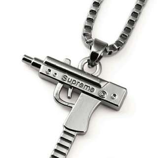 Supreme gun necklace on sale price