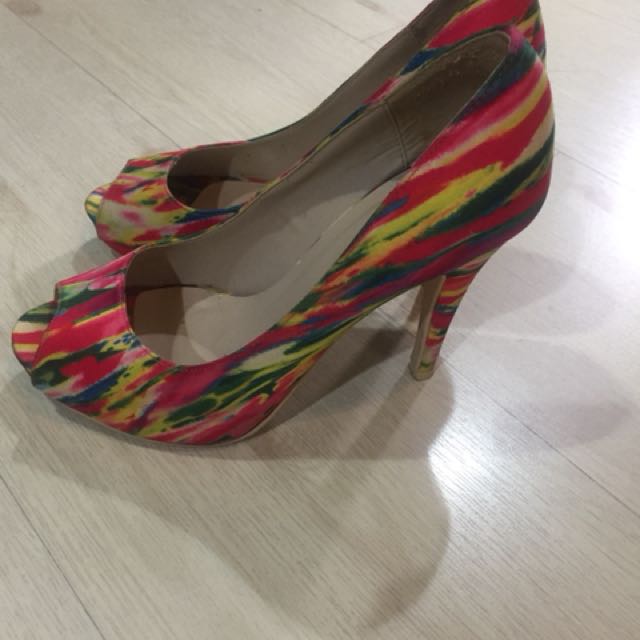 Call it Spring multicolor peep toe heels (Category: Heels) located in Quezon City. Submitted by mdjpl (Listing ID 155557547, Image 2). Description: Size 8 In good condition except for flaw one back heel 4.5 inch heels RFS: Decluttering.