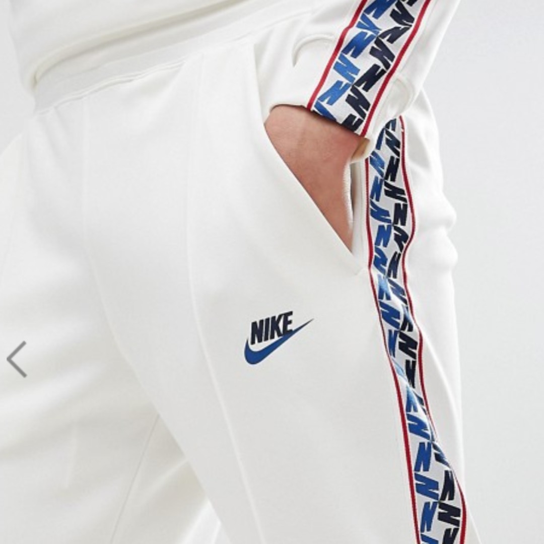 nike joggers with taped side stripe
