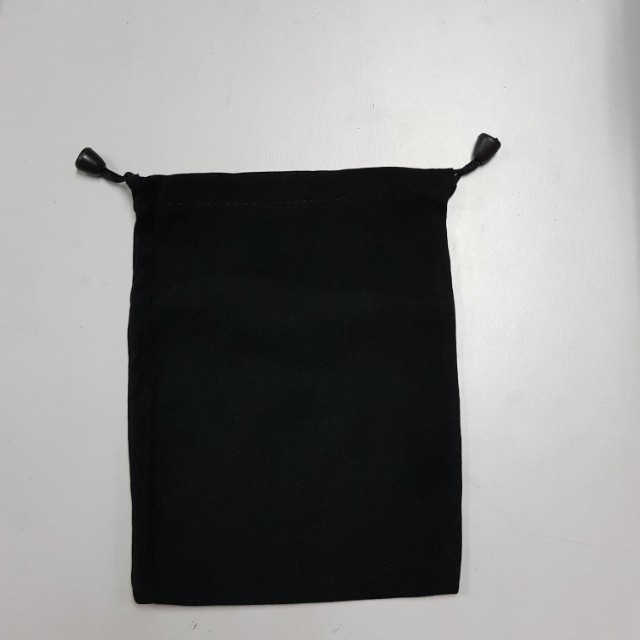 Drawstring Pouch (Category: Purses & Pouches) located in Singapore. Submitted by eterna2828 (Listing ID 155692693, Image 2). Description: Drawstring Pouch. 19 x 15 cm Material - Felt. Black only. Suitable for keeping gadgets cables, earphone, powerbank, sunglasses etc. Get things organized on travel trip. Note: Selling in bundle of 10 pcs for $10.00.