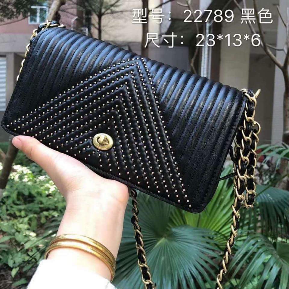 coach dinky quilted black