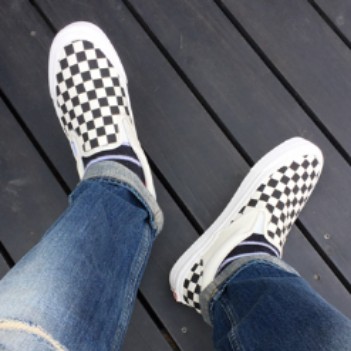 vans checkerboard slip on on feet