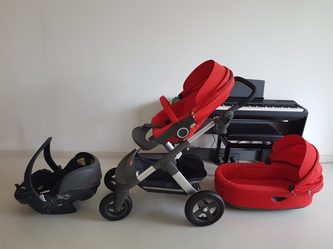 Stokke Trailz stroller with a carry cot a car seat a cup holder