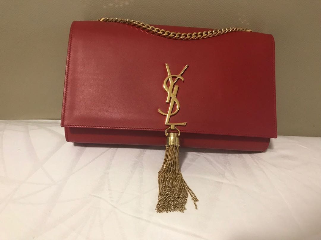 ysl gold tassel