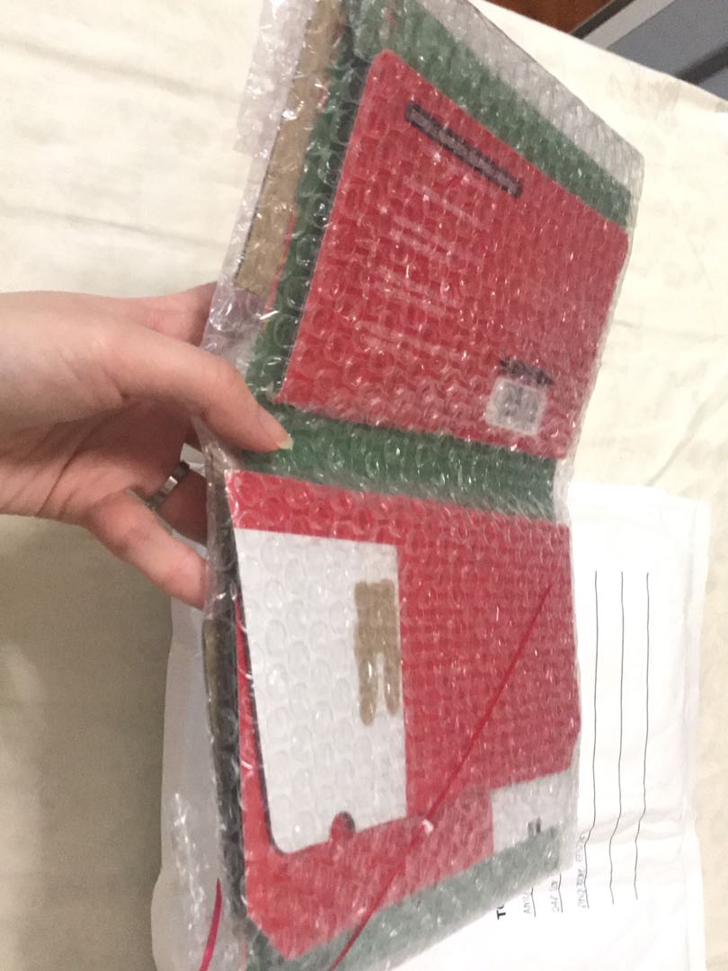 SHINee (Category: K-Wave Merchandise) located in Singapore. Submitted by 1122x0321 (Listing ID 158570653, Image 2). Description: I don’t understand how anyone can mail a L holder like this. Bought the same L holder from the same seller twice and both times received in this kinda state. Please have some common sense when mailing things. I asked you to insert a cardboard to back the folder up. Not just throw in random pieces of small cardboards tha