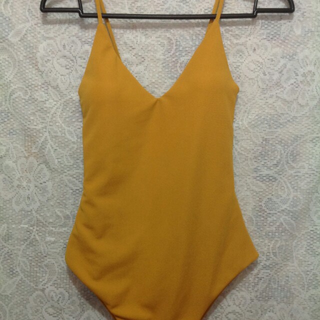 mustard colored swimsuit