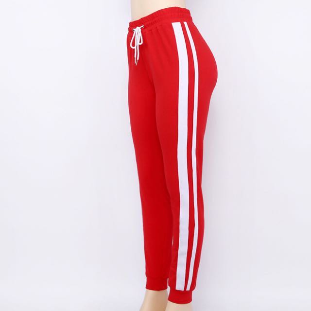 white sweatpants with red stripes