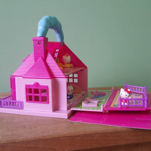 Hello kitty carry on sale along mini doll house
