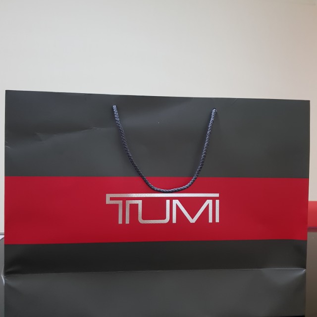 Tumi paper bag top
