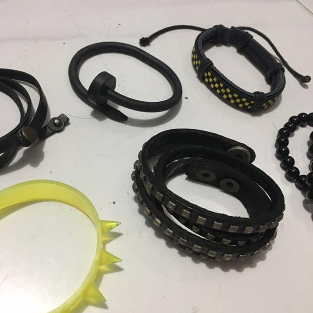 Assorted Bracelets (Category: Bracelets) located in Singapore. Submitted by wooper (Listing ID 156211454, Image 2). Description: ***FREE if you purchase at least 1 item from my listings!*** (otherwise, prices as stated below) Arm candy/candies from growing up True vintage fam • Real Leather Plain Black Bracelet (SOLD) - Worn a number of times - In great condition • Rubber Nail Bracelet (SOLD) - Worn <4 times - In great condition • Black and Yello