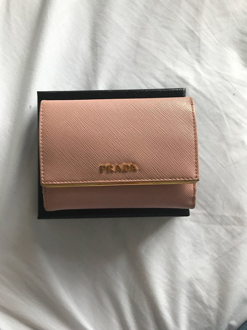 PRADA Saffiano Compact Wallet in Orchid Pink (Category: Luxury Bags & Wallets) located in Las Pinas. Submitted by itsta7 (Listing ID 162774790, Image 1). Description: ✨ PRADA Saffiano Compact Wallet in Orchid Pink ✨ 🍍 Courier: Air21 or LBC 🍍 Will allow pick up for the item 🍍 Payment Options : BPI / Landbank 🍍 Reservation 24 hrs only 🍍 No Returns / Exchange / Swap - Used but still in very good condition - There are minimals scratches in the i