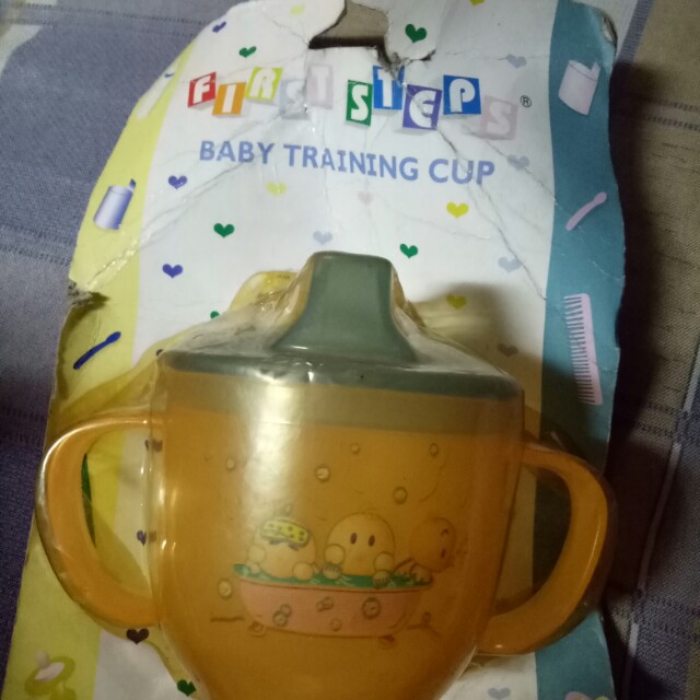 First Step - Baby Training Cup (Orange) (Category: Toilet Training) located in Mandaluyong City. Submitted by appleblossoms07 (Listing ID 162898800, Image 1). Description: new but old stock #0246.