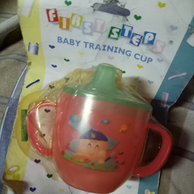First Step - Baby Training Cup (Category: Toilet Training) located in Mandaluyong City. Submitted by appleblossoms07 (Listing ID 162899009, Image 1). Description: new but old stock #0247.