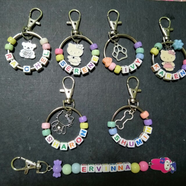 Personalize name keychains (Category: Handmade Craft) located in Singapore. Submitted by galz22 (Listing ID 163309521, Image 1). Description: Good to give as a gift for birthday, teacher day, children day, Christmas day and many other occasions. For beads color, we will mix and match for you. Waiting time: 2-3 days after finalised name. Key ring size 4cm with beads will be 4.5cm. $4.00 set with 1 key ring, 1 hook and 1 charms. 6 color beads with 