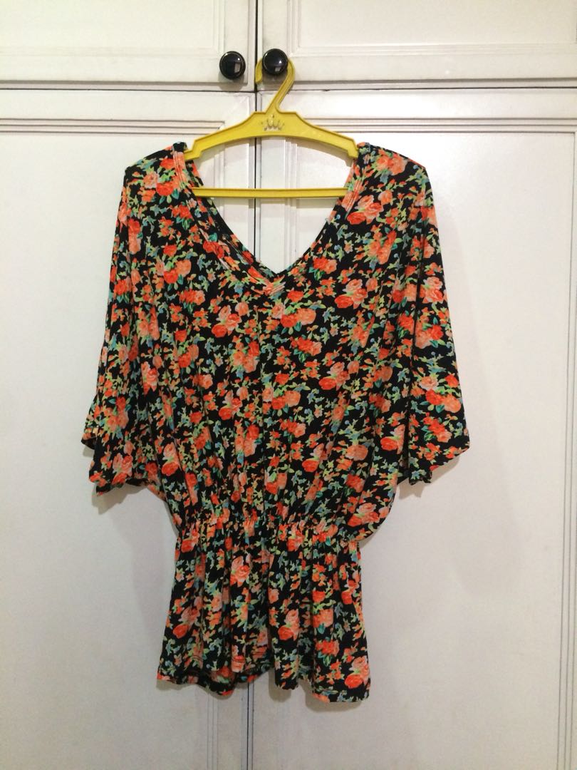 Black Floral Top (Category: Sleeveless) located in Makati City. Submitted by clawdjaa (Listing ID 163453212, Image 1). Description: Black Top with a v-neck cut and an orange floral print. Flattering cut! .