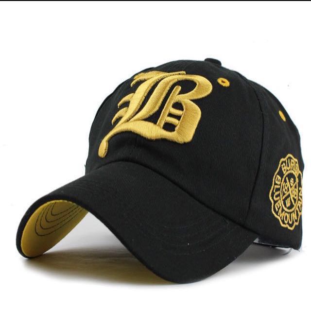 black and gold baseball cap