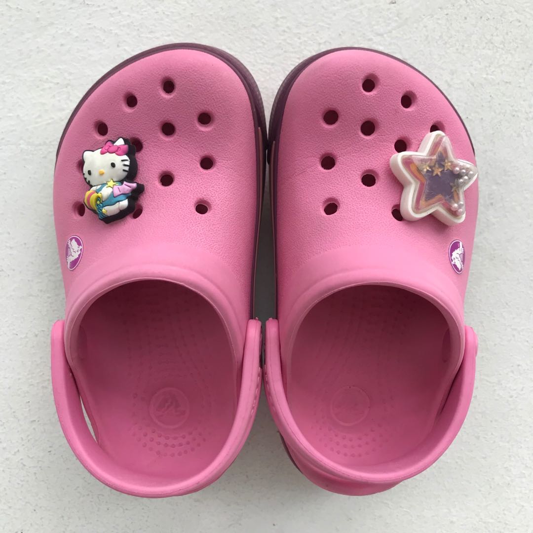pink crocs with charms
