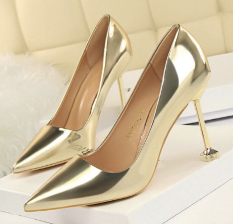 gold pointed high heels