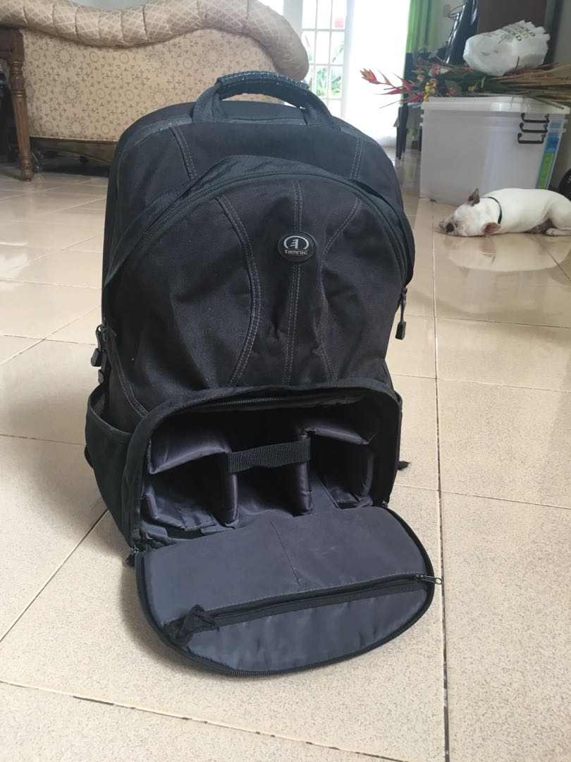 Tamrac - Camera Backpack (Category: Camera Bags & Carriers) located in Paranaque City. Submitted by ranjeman (Listing ID 164184962, Image 1). Description: For Sale: Tamrac Backpack Can fit 2-3 lens and body with extra luggage at the top. Can fit 17in laptop. RFS: seldom used *condition 8/10 - all zippers and cushions still intact. Php 3,000 For faster transaction sms 09178419672.
