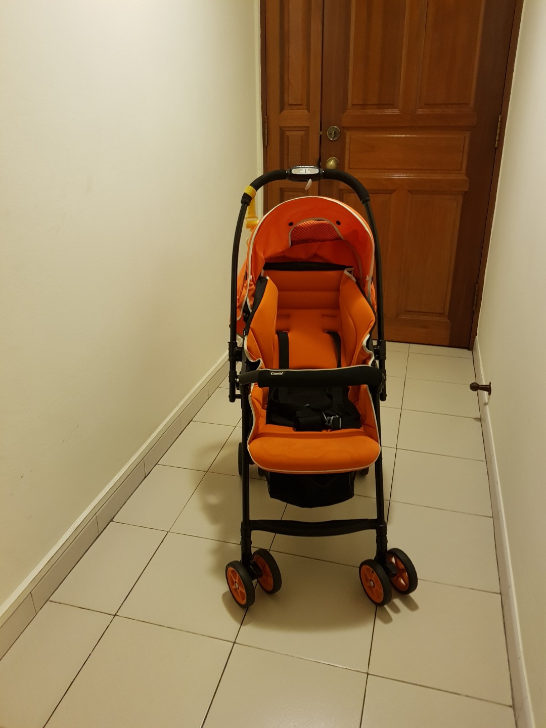 Combi stroller orange top