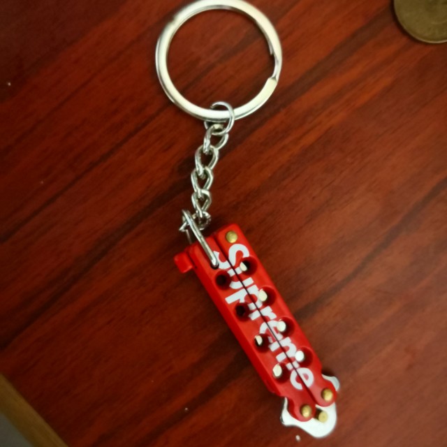 Supreme butterfly knife keychain red hot sale