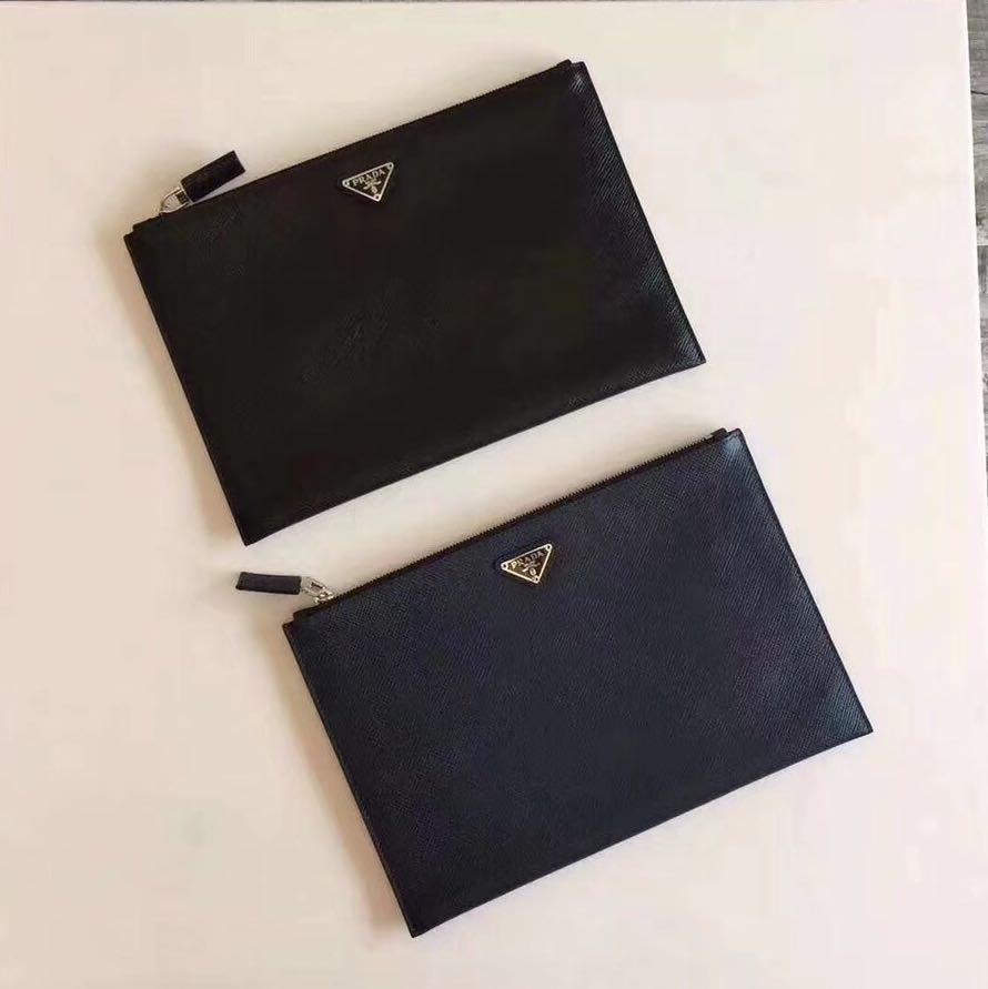 Prada clutch bag (Category: Bags & Wallets) located in Singapore. Submitted by vogue_luxury (Listing ID 166364550, Image 2). Description: From: 🇮🇹 Size: 28cm Material: 100% leather 🐃 Full certification with box Available for preorders: within 15~30 days, subject to customs clearance delay. Retail above $1.5k Now on best offer! Sample pics are for reference only Thank you.
