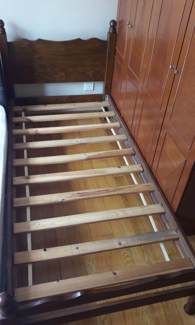 Single Bedframe (Category: Bed Frames & Mattresses) located in Singapore. Submitted by 3larch (Listing ID 166540554, Image 2). Description: Dark brown stained solid timber bed frame. Beautifully carved headboard and legs. Sturdy and lasting. Item is Already dismantled. Can be transported easily. Easy to assemble with precision screws. Solid timber slats. Fit regular sized single mattress. (Mattress in 1st pic not included).