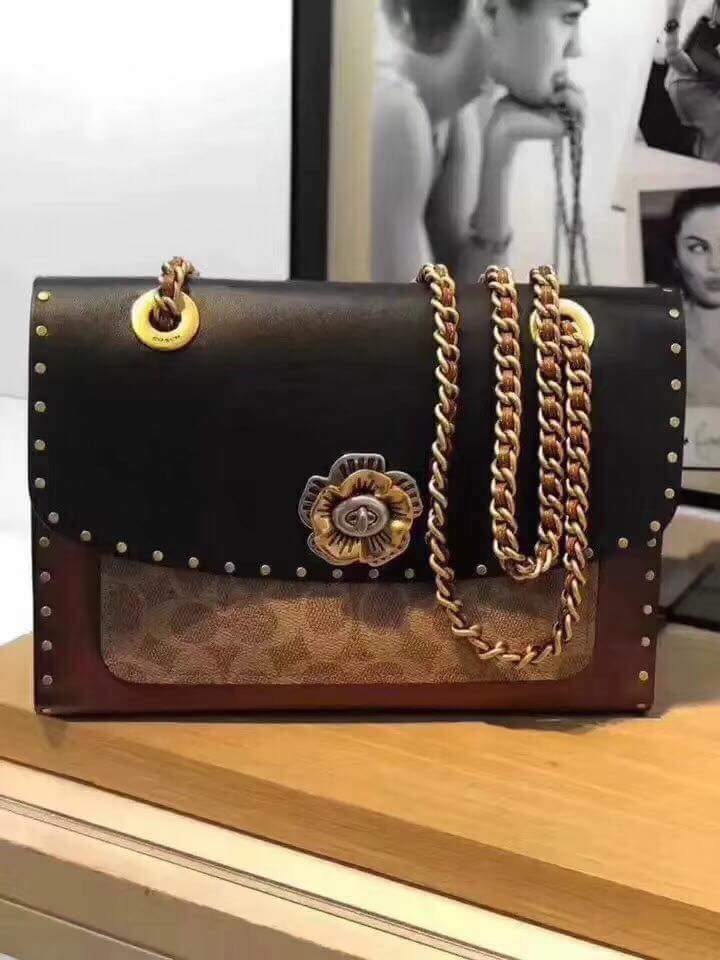 coach parker with rivets and snakeskin detail