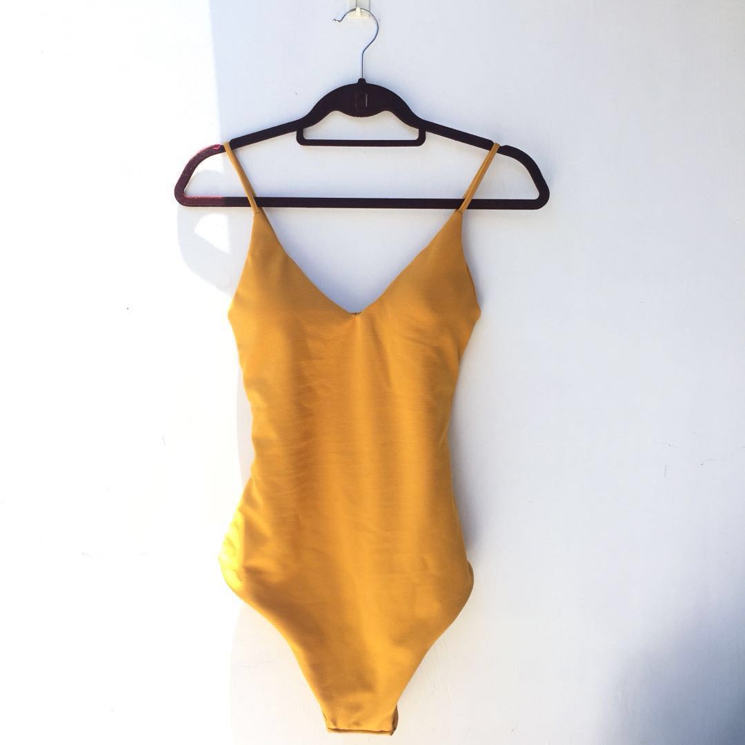 mustard colored swimsuit